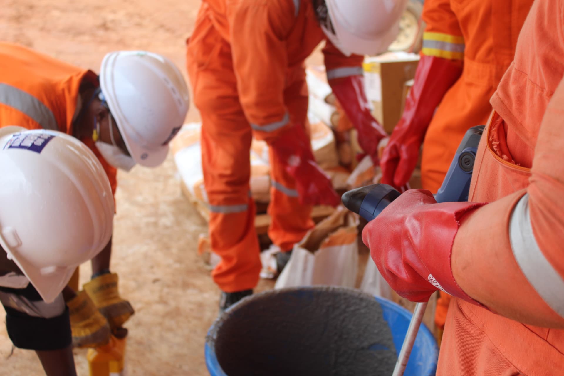 Site team mechanically mixing non-shrink grout on site
