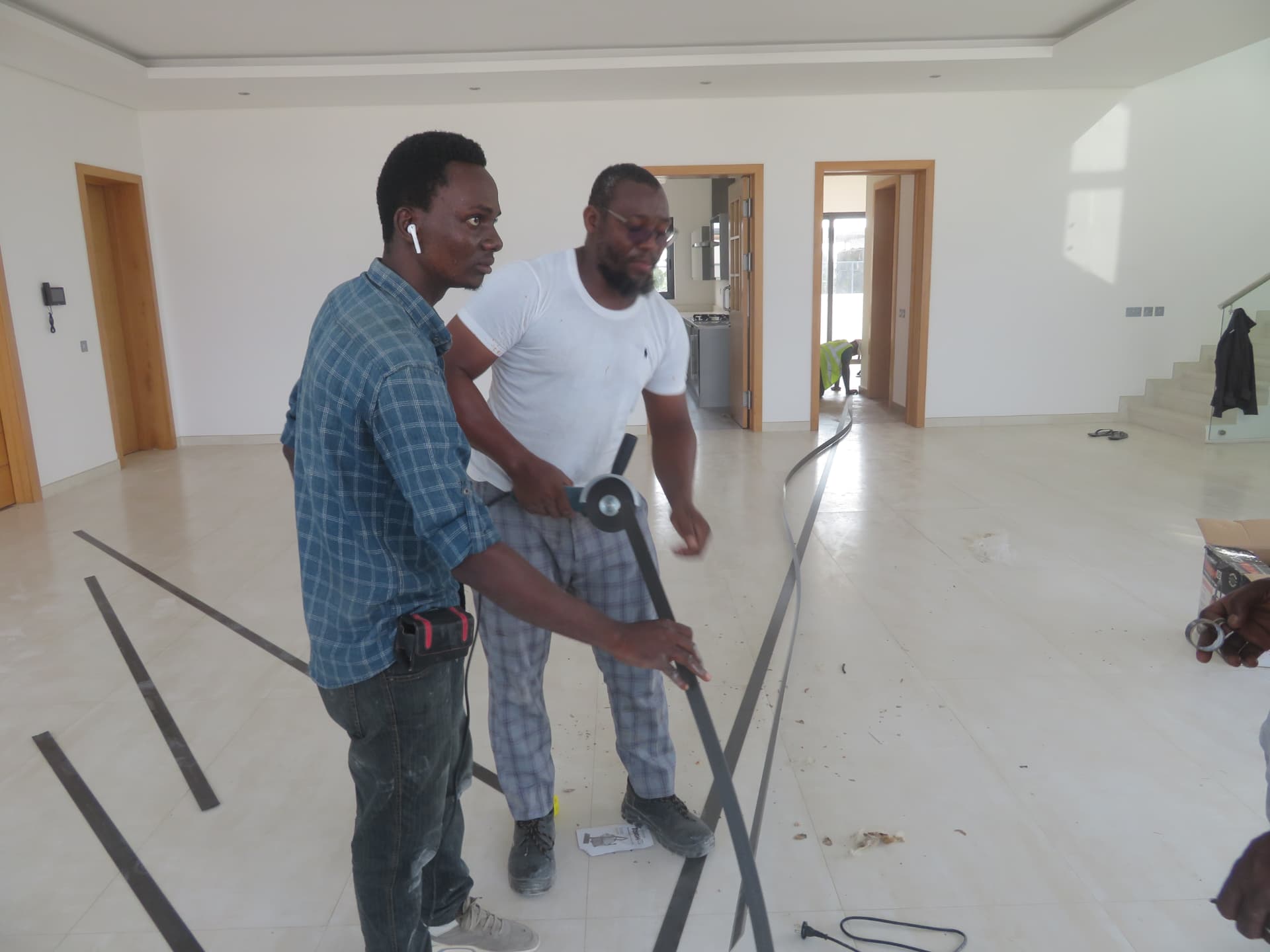 Cutting carbon fibre laminate strips to length before installation