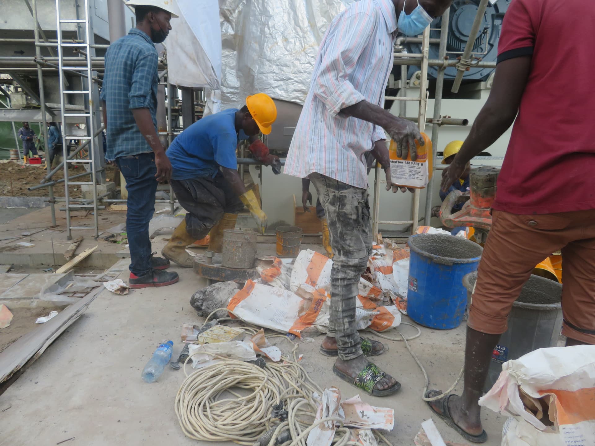 Grout mixing and placement team at the equipment plinth