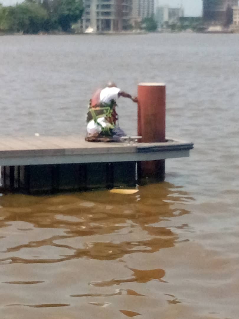 Operative preparing a corroded steel pile at the jetty head