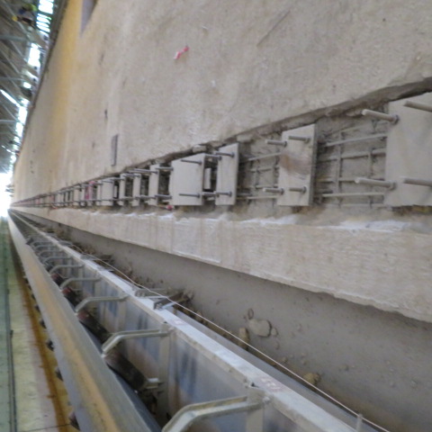 Grouted base plates along the reclaimer rail track