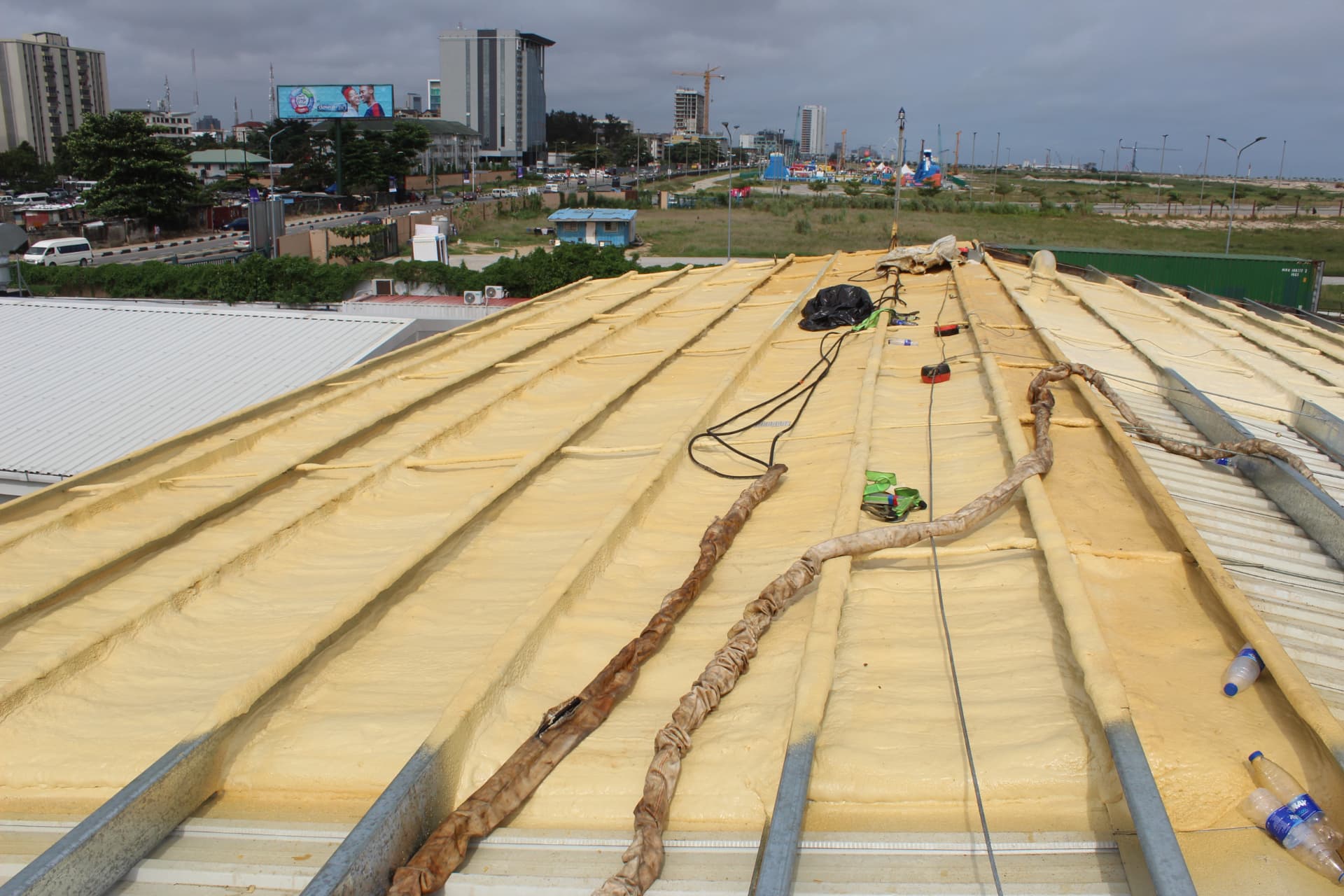Completed spray foam insulation covering the full length of the roof deck
