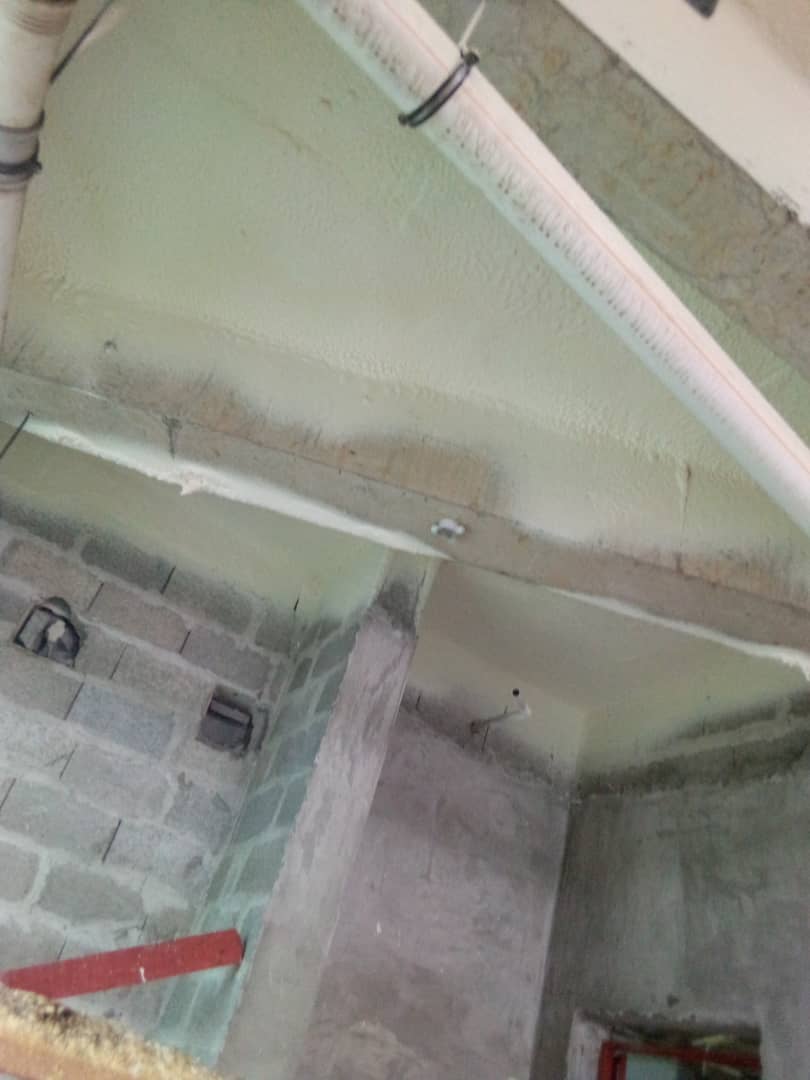 Insulated beam and soffit above blockwork within the tower